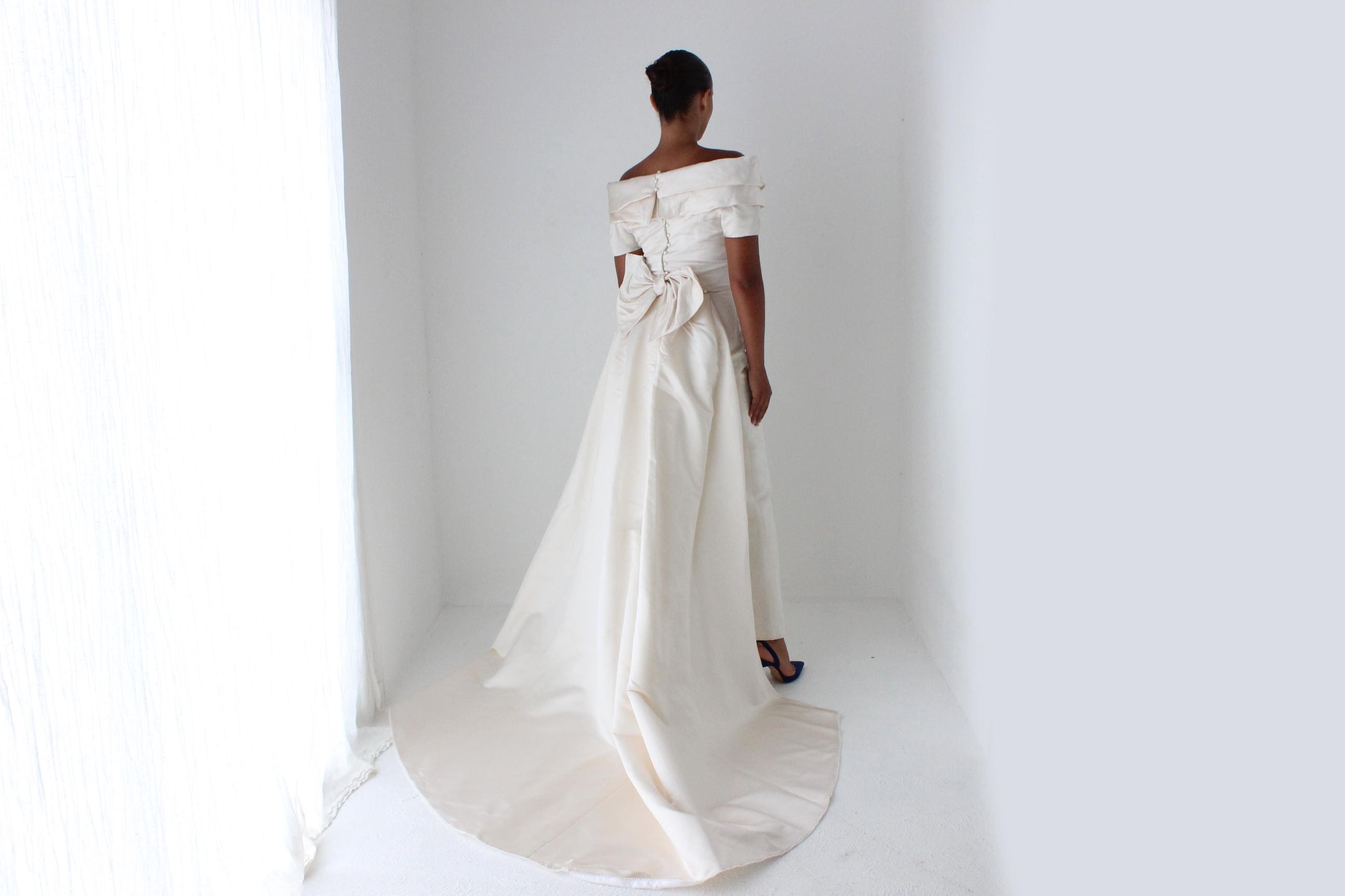 1990s Duchess Silk Off Shoulder Hourglass Gown w/ Back Bow + Detachable Train